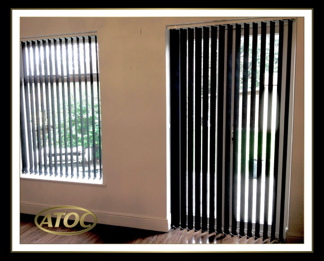Vertical blinds fitted to patio and bi-fold doors in an Essex home for flexible light and privacy